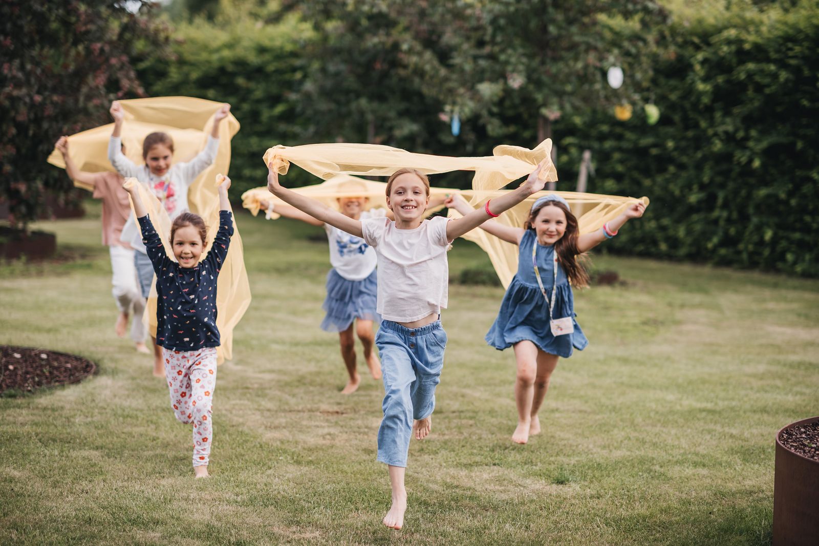 Preschool campers playing outdoors at Exupery Camp
