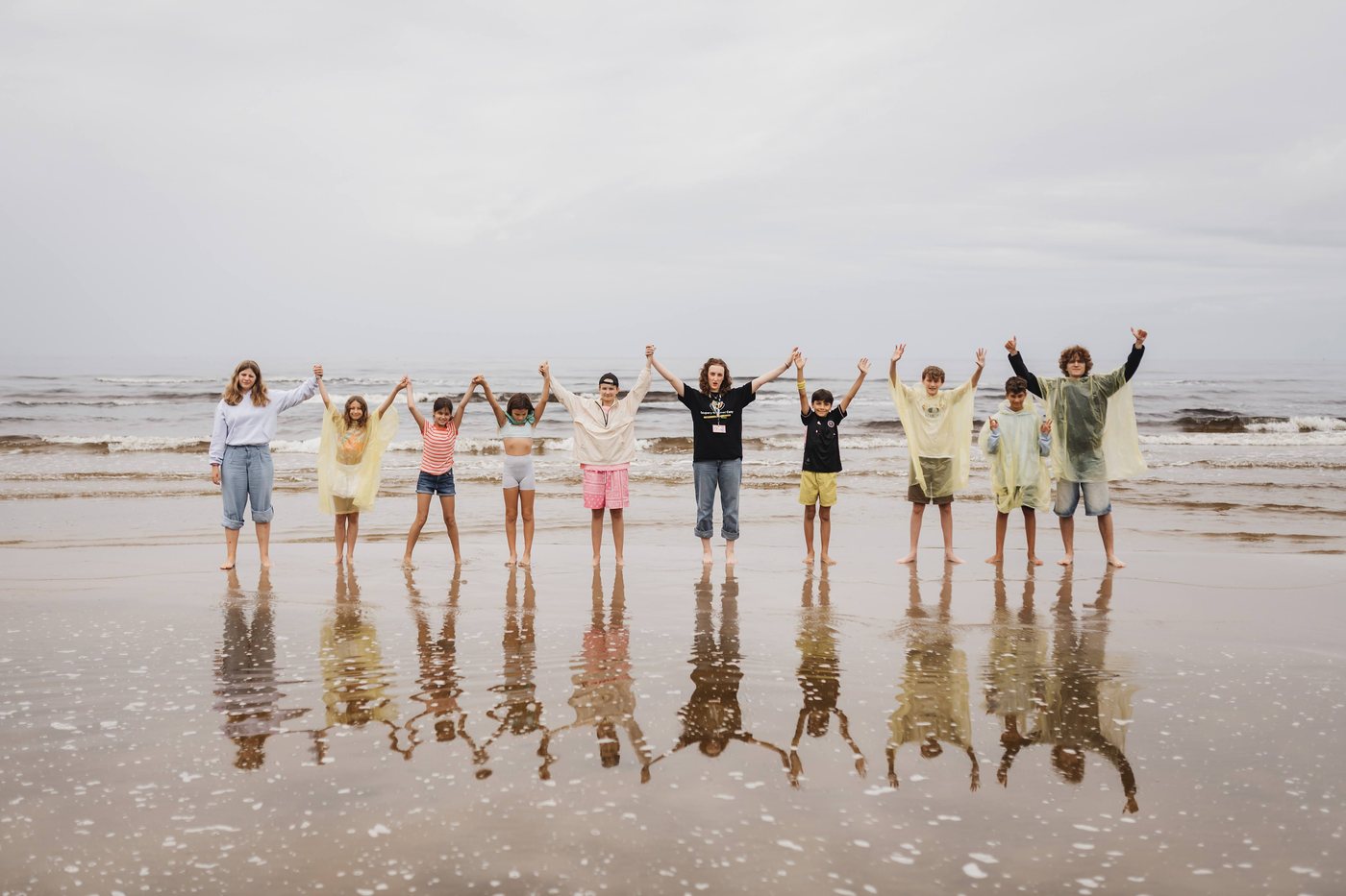 Campers and counsellors cheering together on the Jūrmala beach — Film Expedition week
